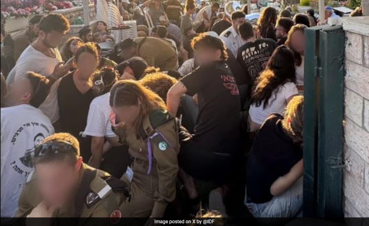 People Run For Cover After Air Raid Sirens Go Off In Israel